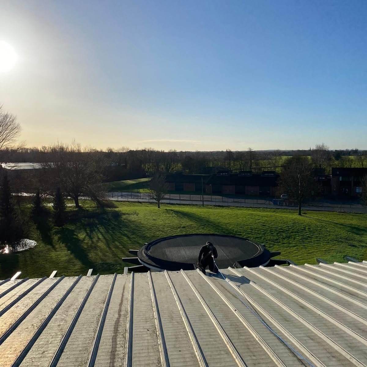Commercial roof cleaning carried out by TLC Window Cleaning using safe access equipment